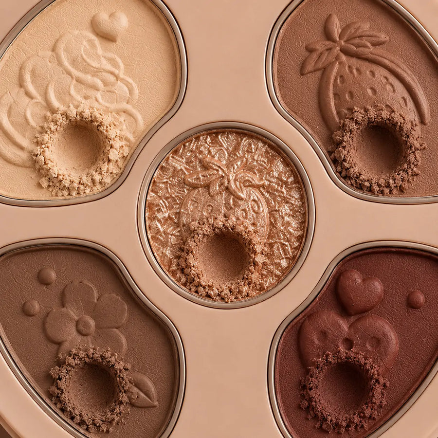 Paleta de sombras O Sfumato™ Chocolate Cacau com tons bege, marrom, cacau e brilho dourado em embalagem redonda.