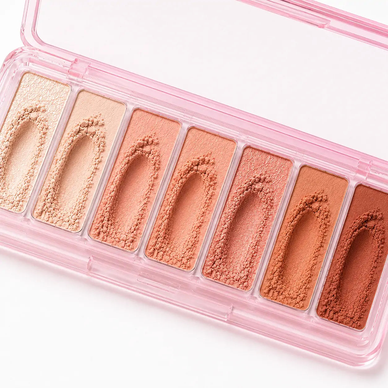 Close da paleta de sombras O Sfumato™ Rosa Pêssego mostrando textura e pigmentação dos tons