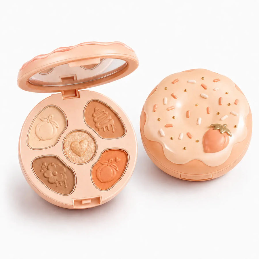 Paleta de sombras O Sfumato™ Pêssego Caramelo em embalagem redonda com tons pêssego, caramelo, nude e marrom.